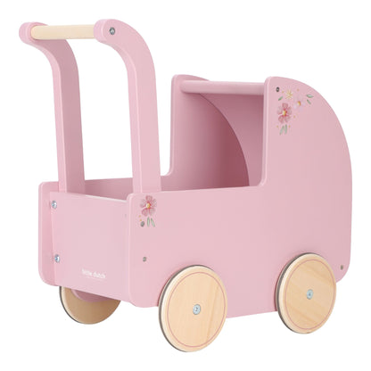 Pink doll pram with wooden wheels on a white background